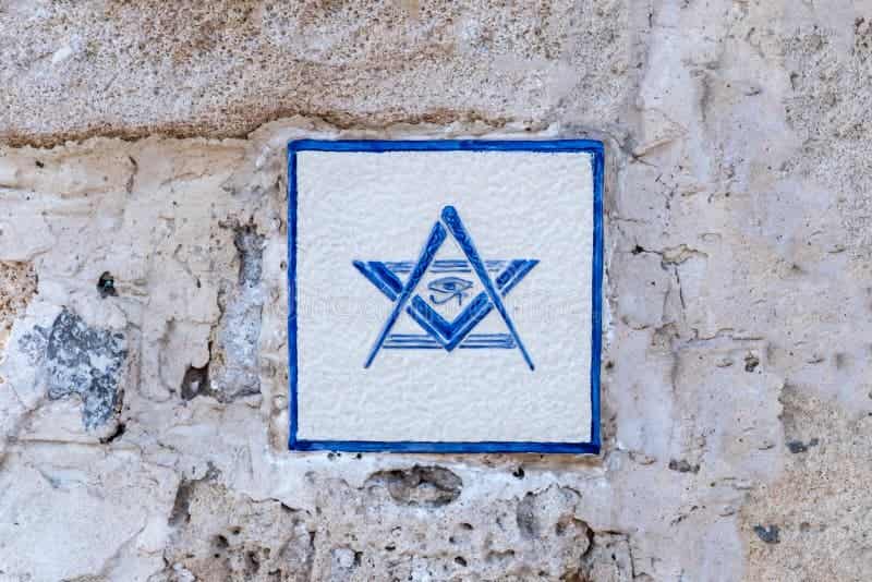 Tel Aviv-Yafo, Israel - December 19, 2021: Freemason emblem on the old ruined wall.
