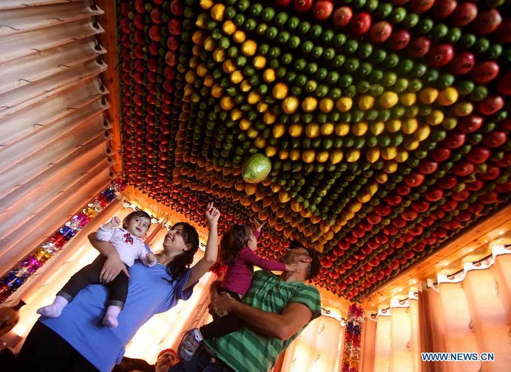 A Samaritan family celebrating Sukkot. Photo by Xinhua/Ayman Nobani